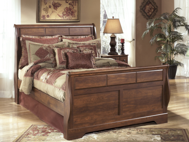 Large bed with wood headboard